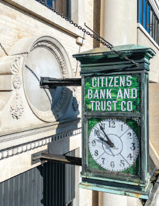 Main office of Citizens Bank & Trust shot of their green stained glass clock